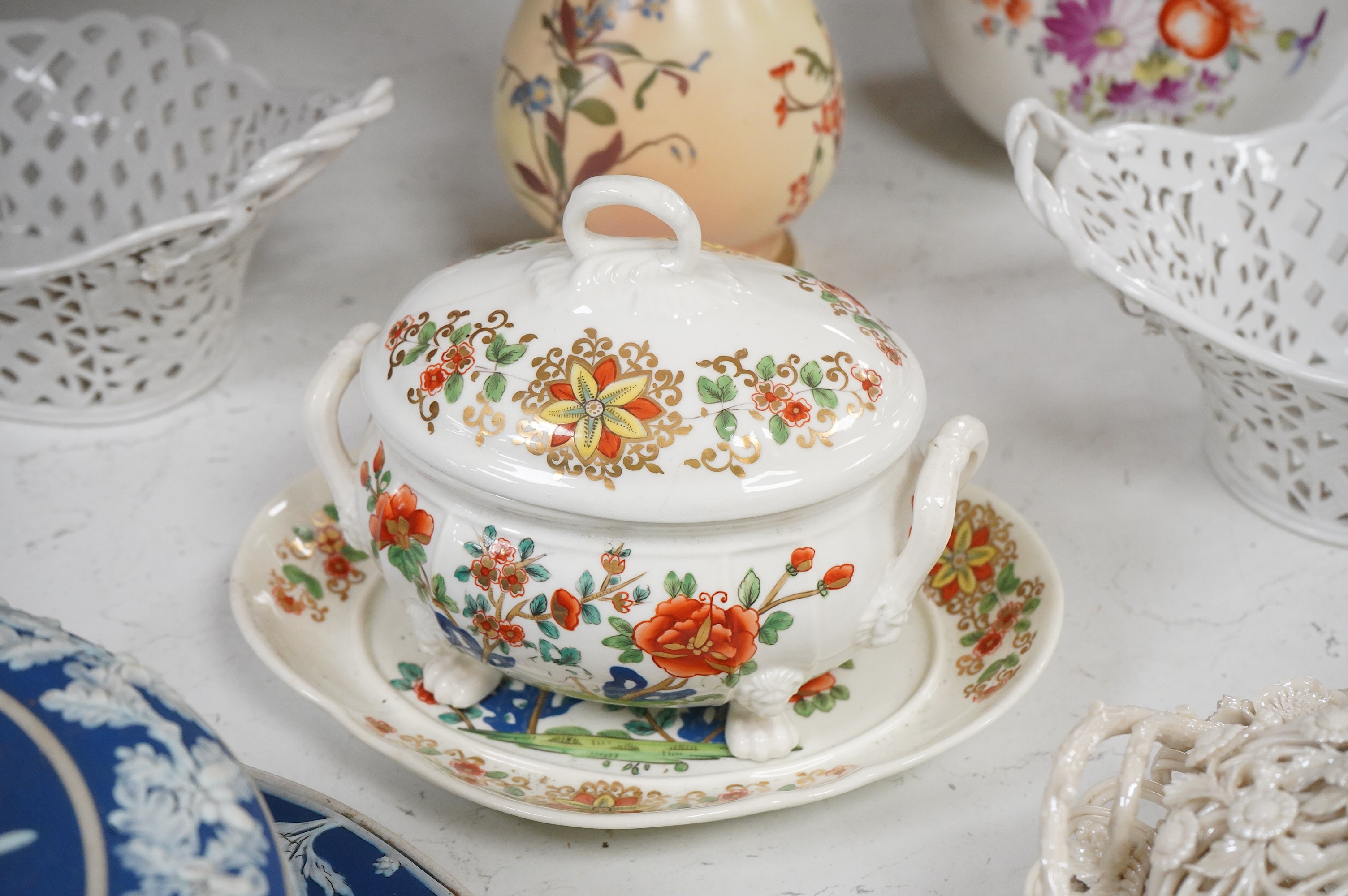 A 19th century Derby tureen and cover, a pair of Royal Worcester blush vase-26cm high, a Belleek basket and cover, a Wedgwood blue Jasperware cheese dish and associated cover, two continental baskets and vase. (7).